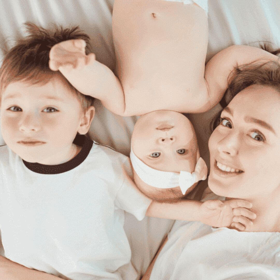 Mother-with-Children-on-the-Bed